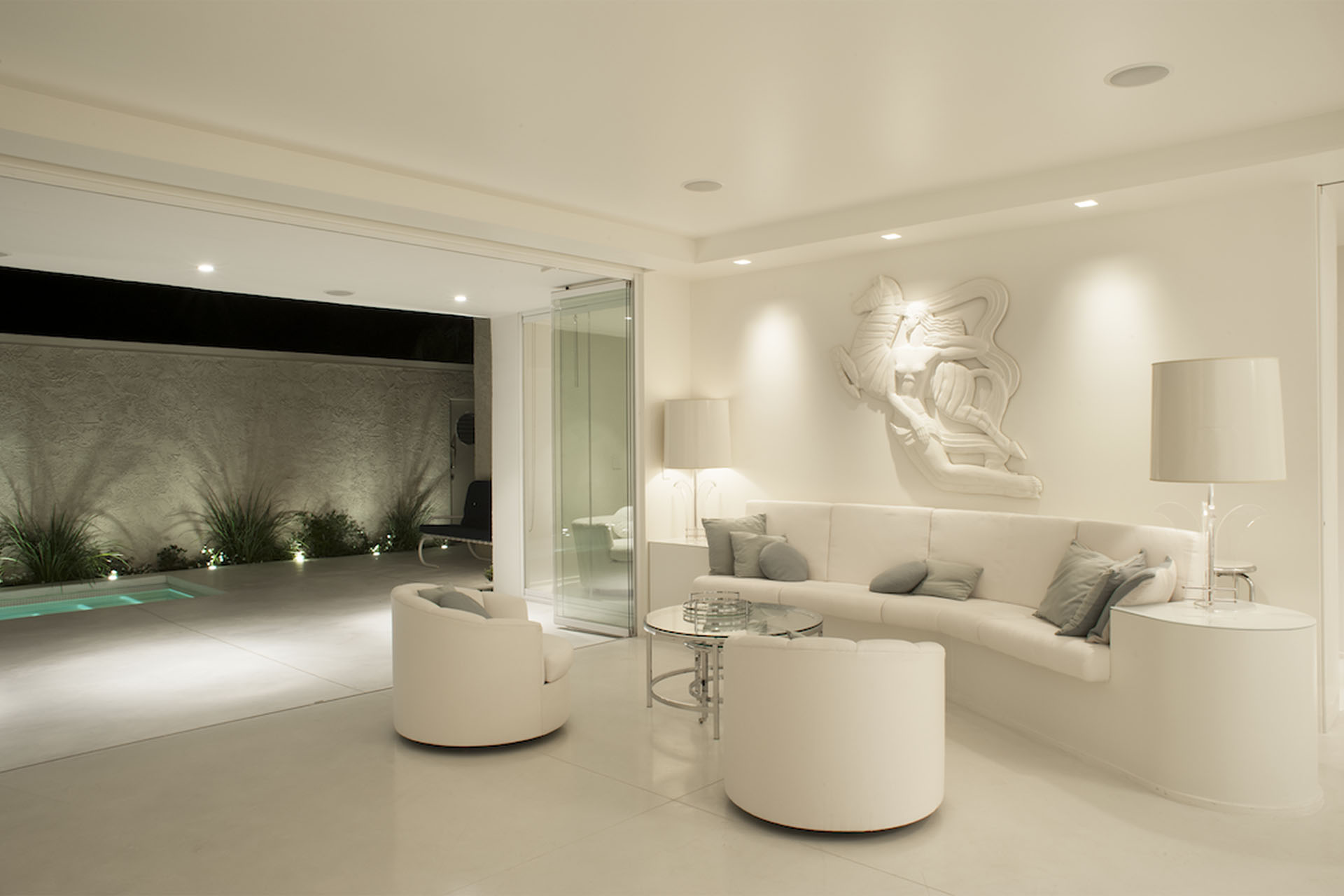 white living room frameless glass
